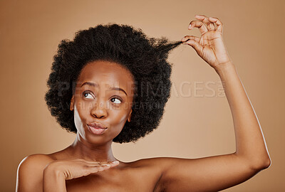 Buy stock photo Hair care, black woman and natural afro for beauty in studio isolated on a brown background. Growth, hairstyle and African female model pose with cosmetics after salon treatment for healthy wellness