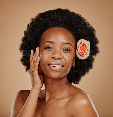 Buy stock photo Black woman, face and skincare with rose in studio isolated on a brown background. Portrait, flower and happy African model with natural cosmetics, organic facial treatment and floral beauty plant.