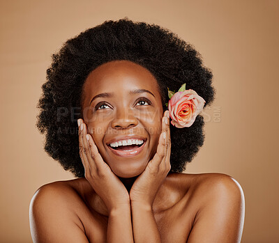Buy stock photo Face, black woman and skincare with rose for beauty in studio isolated on a brown background. Floral flower, excited and African model with natural cosmetics, thinking and organic facial treatment.