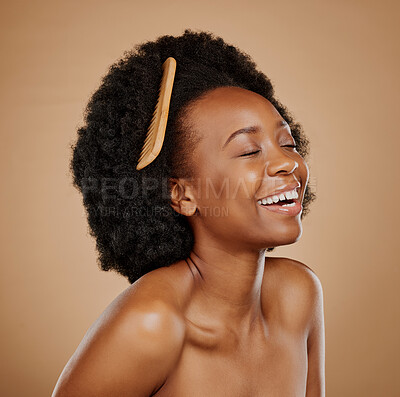Buy stock photo Hair, comb and a model black woman laughing in studio on a brown background for beauty or cosmetics. Funny, afro and haircare with an attractive young female person feeling excited for natural care