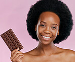 Portrait, chocolate and black woman with a smile, natural beauty and dessert on a studio background. Face, female person or Jamaican model with sweets, cocoa candy or delicious snack with sugar treat