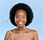 Face, bamboo toothbrush and black woman smile in studio isolated on a blue background. Portrait, brushing teeth and model with natural, eco friendly or healthy wood for dental, cleaning or hygiene.