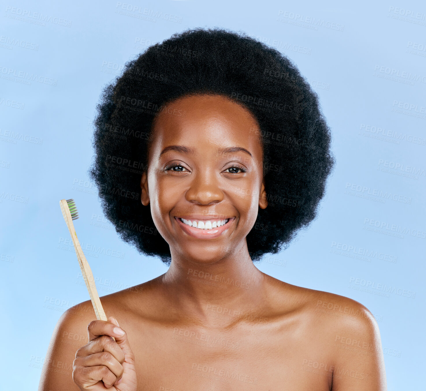 Buy stock photo Face, bamboo toothbrush and black woman smile in studio isolated on a blue background. Portrait, brushing teeth and model with natural, eco friendly or healthy wood for dental, cleaning or hygiene.