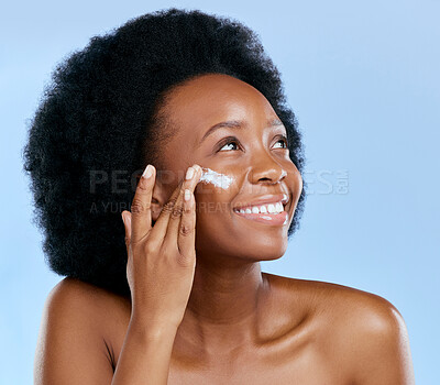 Buy stock photo Black woman, face and cream, beauty and skincare with cosmetics on blue background. Moisturizer, lotion and product for skin with sunscreen and happiness, female model and dermatology in studio