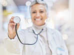 Portrait, medicine and stethoscope with an old woman doctor in the hospital for cardiology or treatment. Medical, heart health and wellness with a senior female medical professional in a clinic