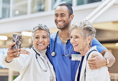 Buy stock photo Teamwork, selfie and medical staff with happiness, collaboration and social media in a hospital. Doctors, nurse and group with connection, healthcare professional and medicine with career and memory