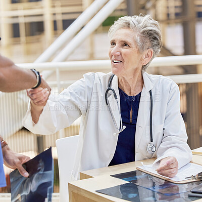 Buy stock photo Senior doctor, shaking hands and introduction, thank you and congratulations with gesture and health. Welcome, communication and support in medicine, female medical professional and handshake