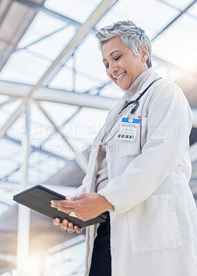 Buy stock photo Doctor, woman and smile with tablet for medical information, data research or healthcare in hospital. Happy female employee, digital technology and planning telehealth, internet app or online results
