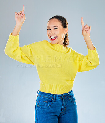 Buy stock photo Pointing, promotion and presentation with portrait of woman in studio for show, advertising and idea. Announcement, space and deal with person on grey background for opportunity, offer or news mockup