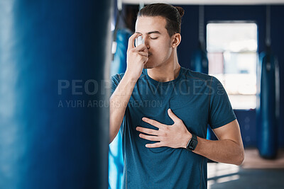 Buy stock photo Asthma pump, breathe and man with fitness, medicine and wellness spray for health. Breathing, inhaler and lung relief with a male person in a gym with workout and medical problem support for care