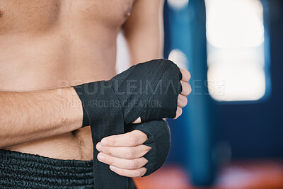 Buy stock photo Fitness, boxing and man wrap hands with closeup in gym for training, workout and exercise. Sports, body builder and male athlete ready with bandage for boxer competition, practice and mma fight