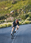 Bicycle, motion blur and man cycling fast in nature, mountain or adventure on trail, forest or valley path. Athlete, fitness and extreme bike sports with freedom, energy and off road exercise