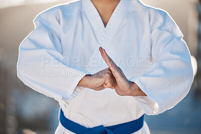 Buy stock photo Sport, fitness and fighting with a karate man in gi, training in the city on a blurred background. Exercise, discipline or respect with a male athlete during a self defense workout for health closeup