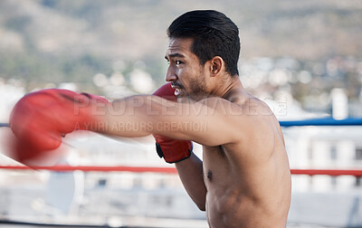 Buy stock photo Rooftop, fitness and man boxing, training and exercise with wellness, competition and exercise. Male person, boxer and athlete outdoor, punching and activity with focus, gloves and fighting skills