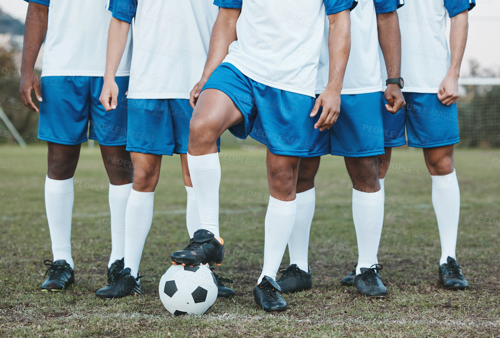 Buy stock photo Soccer ball, sports group and feet of a team on a field to start fitness training or game outdoor. Football player, club and legs of athlete men together for sport competition, exercise and challenge