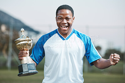 Buy stock photo Sports, soccer player and man celebrate trophy for competition or game outdoor. Portrait of black male athlete champion excited for football prize, award and win or achievement and success on a field