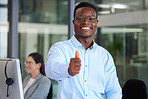 Portrait, thumbs up and a black man at work in a call center for support, motivation or assistance. Customer service, thank you and success with a male consultant working as a winner in telemarketing