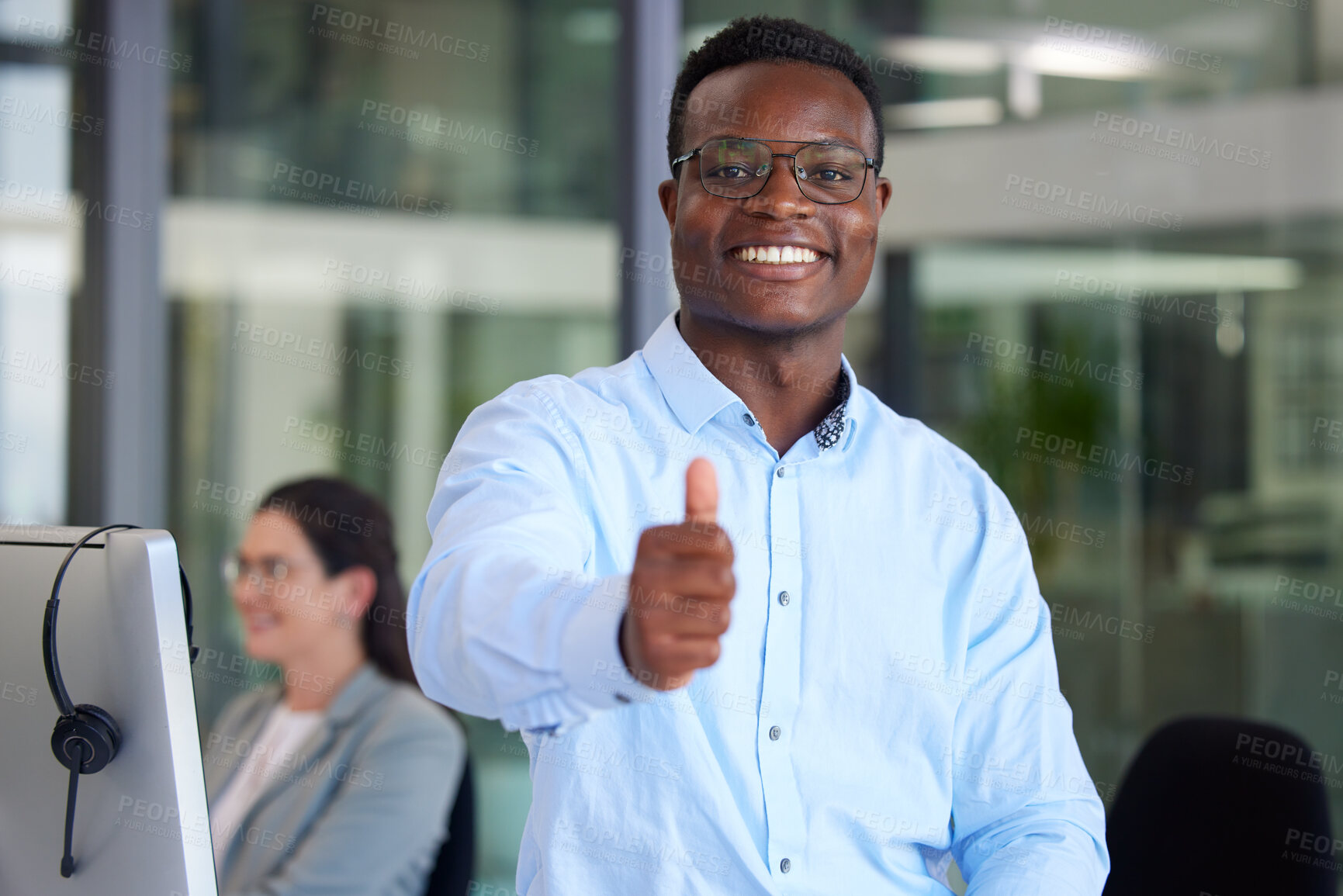 Buy stock photo Portrait, thumbs up and a black man at work in a call center for support, motivation or assistance. Customer service, thank you and success with a male consultant working as a winner in telemarketing