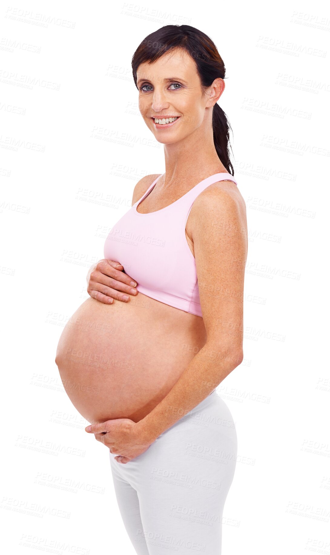 Buy stock photo Portrait, smile and stomach with a pregnant woman isolated on a transparent background for motherhood. Mama, happy and pregnancy with a maternal young mother holding her abdomen or belly on PNG