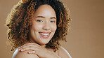 Black woman face, beauty and cosmetic wellness of a model in a studio with mockup. Skin glow, cosmetics portrait and young African person with a smile from dermatology skincare with brown background