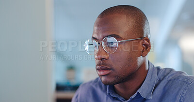 Buy stock photo Serious black man, computer and focus for research, project deadline or trading at office. African male person, designer or employee working on PC or reading email, information or tasks at workplace