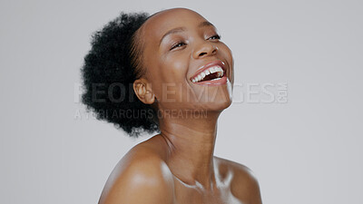 Buy stock photo Black woman, afro and smile with beauty, skincare and healthy skin for portrait, moisturizer and blue studio background. Happy, female and sunscreen for dermatology, cosmetology and facial treatment
