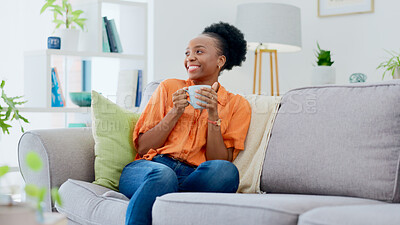 Buy stock photo Black woman, smiling and couch with tea, relaxing and cozy home for self care, living room and break. Me time, comfort and quality time in house, sofa and day off for resting, laughing and happiness