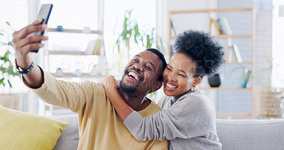 Buy stock photo Black couple, selfie and smartphone at home, smile and living room, happiness and couch. Quality time, bonding and romance with man, woman and relationship for memories, social media and dating