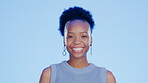 Happy, smile and face of a black woman in a studio with a confident, good and positive mindset. Happiness, excited and portrait of African female model laughing at a comic joke by a blue background.