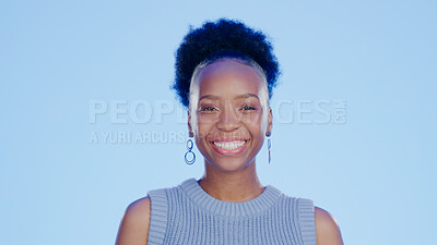 Buy stock photo Smile, happy and portrait of black woman in a studio with positive, confident and good attitude. Excited, pride and young African female model with joy and happiness isolated by blue background.