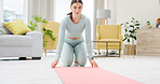 Yoga, home and woman roll mat to start exercise, training or stretching for health, fitness and wellness. Pilates, workout and female yogi rolling rug to get ready or prepare for exercising in house.