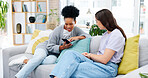 Happy, friends and women on sofa, cellphone and online reading with social media, joyful and relax in living room. Females, girls and smartphone in lounge, search internet for videos or rest together