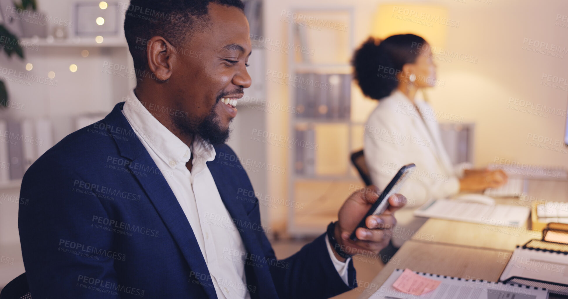 Buy stock photo Night, computer and phone call with black man in office for consulting, networking and communication. Discussion, connection and hello with male in agency for commitment, positive and overtime