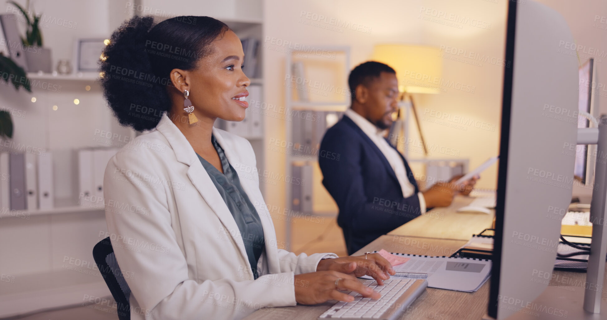 Buy stock photo Business people working night, black woman writing report and team, computer and employee at desk with coworking. Overtime, technology and wifi, collaboration and communication with project deadline