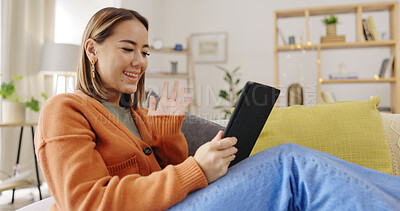 Buy stock photo Happy woman, wave or video call on a tablet, social media network or mobile contact on home sofa. Smile, hello greeting or Asian person talking online for communication on digital app or virtual chat