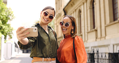 Buy stock photo Selfie of influencer women in city together with smile, nature and memory on social media with sunglasses. Photography, happiness and friends on urban travel for holiday blog, post or live stream.