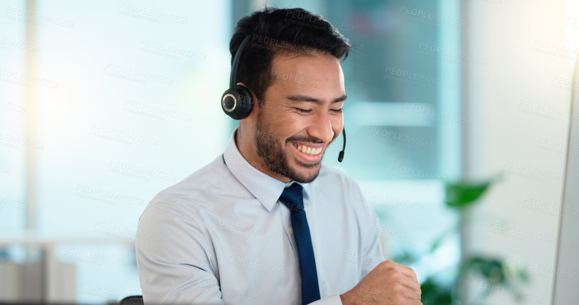 Buy stock photo Call center agent consulting a buyer via video call in an office. A young friendly sales man talking to a client in a virtual meeting. A male customer service employee advising a consumer