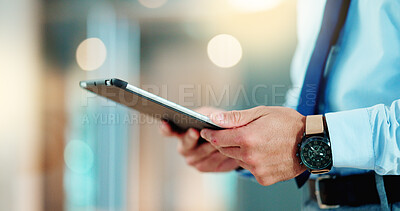 Business man browsing on a digital tablet in an office. Closeup on hands of a corporate professional and expert staying organized with apps. Scrolling on the internet and planning successful ideas