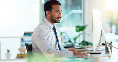 Buy stock photo Busy male Accountant typing an email in a modern office. A financial advisor compiling a finance proposal for a successful company. A serious Auditor writing a business investment report