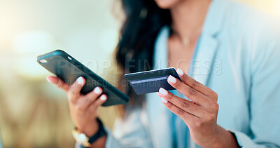 Buy stock photo Bank card data put in phone by a lady who does internet banking by typing on her mobile to make an online credit payment. Young woman texting on her phone to send money via an ewallet transaction