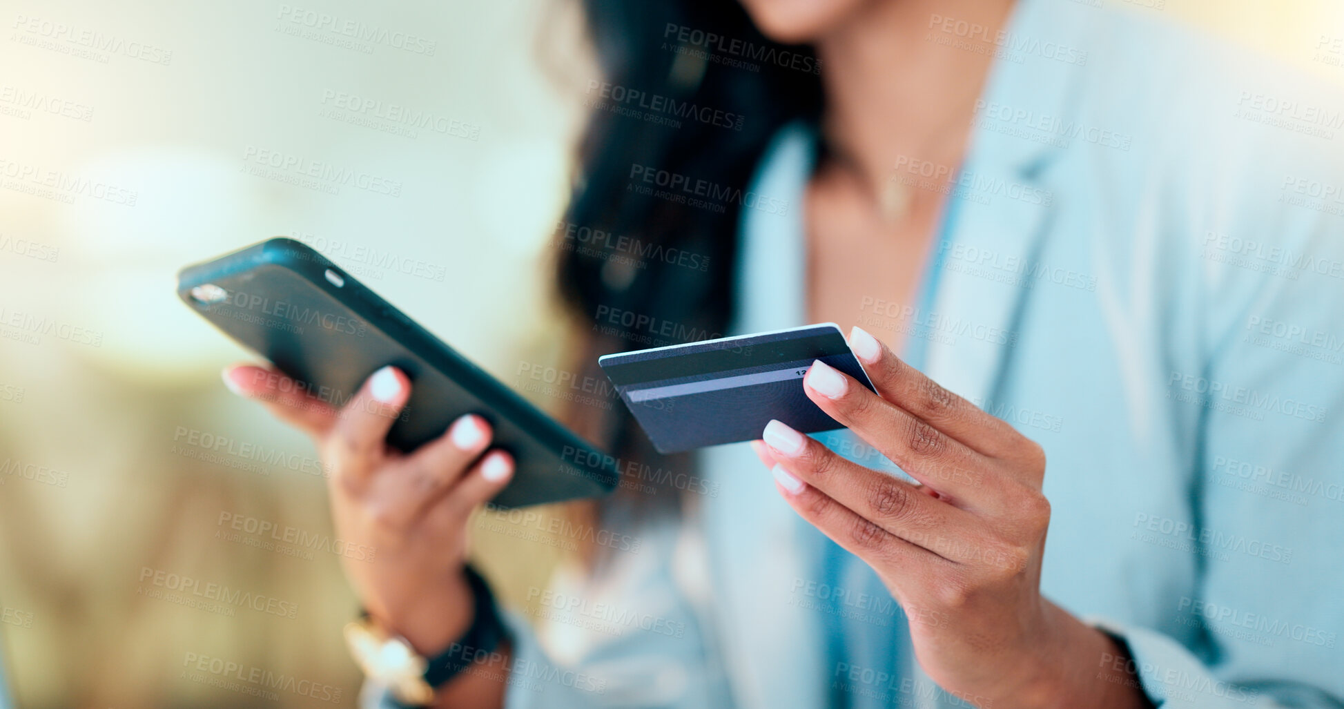 Buy stock photo Bank card data put in phone by a lady who does internet banking by typing on her mobile to make an online credit payment. Young woman texting on her phone to send money via an ewallet transaction