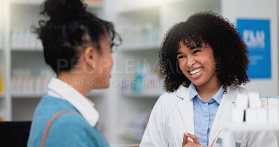 Buy stock photo Young female chemist helping a customer to purchase prescription or chronic medication in the pharmacy. Young woman shopping for medicine and being assisted with advice by a doctor in a labcoat