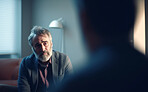 Senior man, sad and listening in psychologist clinic for mental health, grief or stress help. Elderly patient, person and ai generated counsellor in consultation for burnout, anxiety and depression