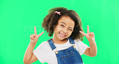 Face, smile and child with peace sign on green screen in studio isolated on a background. Portrait, emoji and wink of happy kid or girl with v hand gesture or symbol for happiness or joy.
