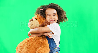 Happy, little girl and hugging teddy bear on green screen of cute innocent child isolated against studio background. Portrait of adorable kid smile with soft toy hug for childhood on chromakey mockup