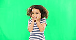 Cute, happy and the face of a child on a green screen isolated on a studio background. Smile, laughing and portrait of an adorable little girl looking cheerful, playful and expressing happiness