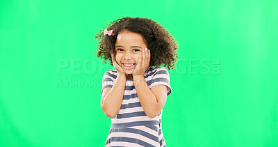 Cute, happy and the face of a child on a green screen isolated on a studio background. Smile, laughing and portrait of an adorable little girl looking cheerful, playful and expressing happiness