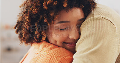Hug, house and a couple embracing with a smile, comfort and love in the living room. Happiness, care and a man and woman hugging for affection, missing and caring together in the lounge of a home