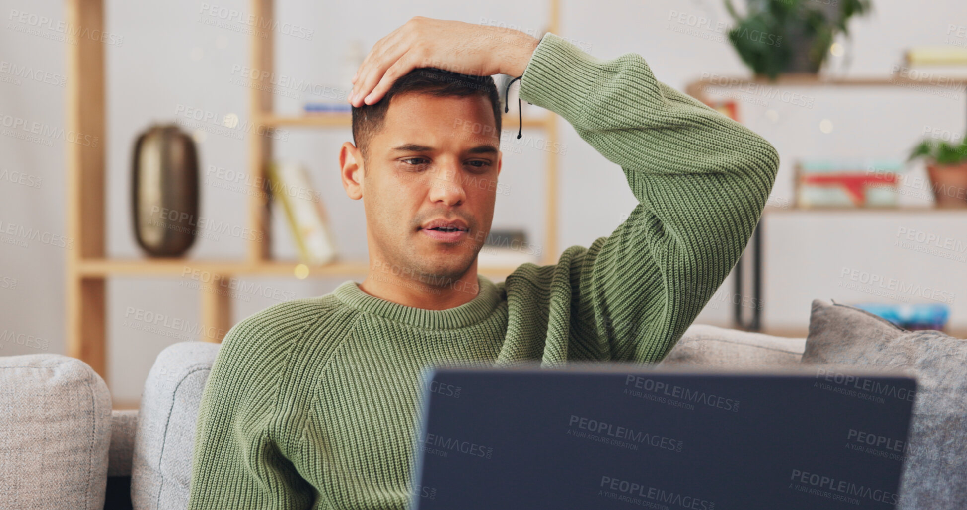 Buy stock photo Man, student and stress on laptop for home education, e learning or college application results, news or fail. Young, confused Mexican man with doubt, online mistake and reading on computer and sofa