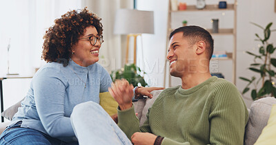 Couple have conversation, communication and funny story in living room, spending quality time together on couch. Partner, love and respect, people talking and connection with laughter and happiness